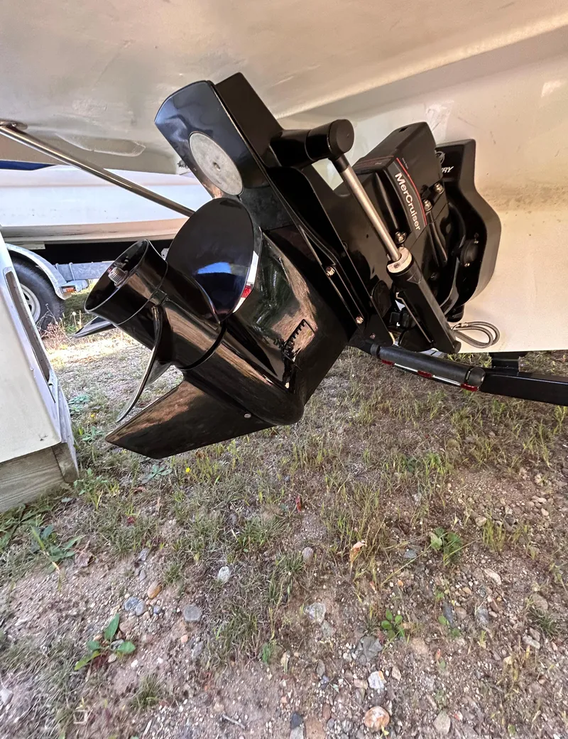 Slide: The Image of 2024 Glastron GX 215 boat outboard motor on dry land. - 8