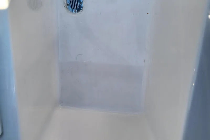 Slide: The Image of Interior view of 2024 Glastron GX 215 boat, featuring a clean white surface. - 16