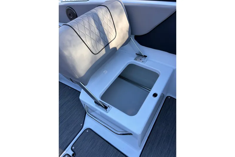Slide: The Image of 2024 Glastron GX 215 boat seat with storage compartment, featuring sleek design and durable materials. - 36