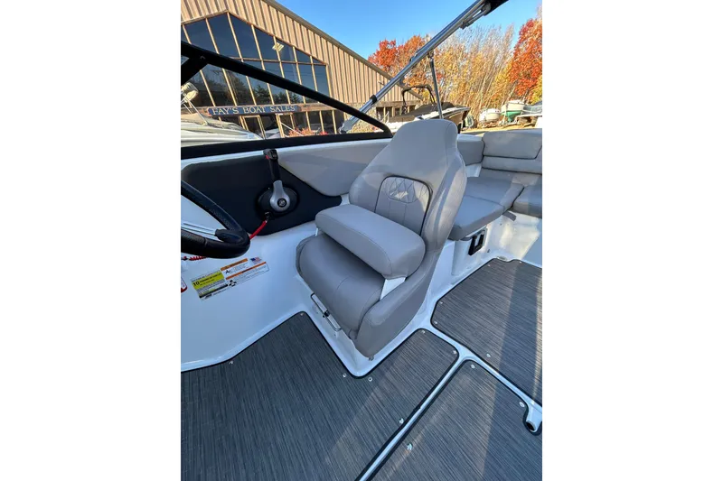 Slide: The Image of 2024 Glastron GX 215 boat interior with gray seating and modern design. - 45