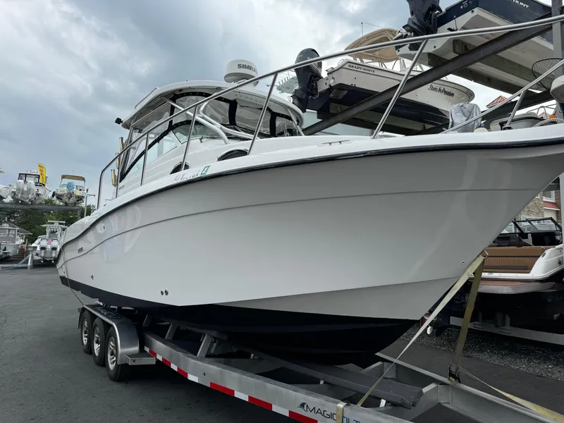 Slide: The Image of 2004 Seaswirl Striper 2901 Walkaround O/B on trailer, ready for boating adventure. - 1