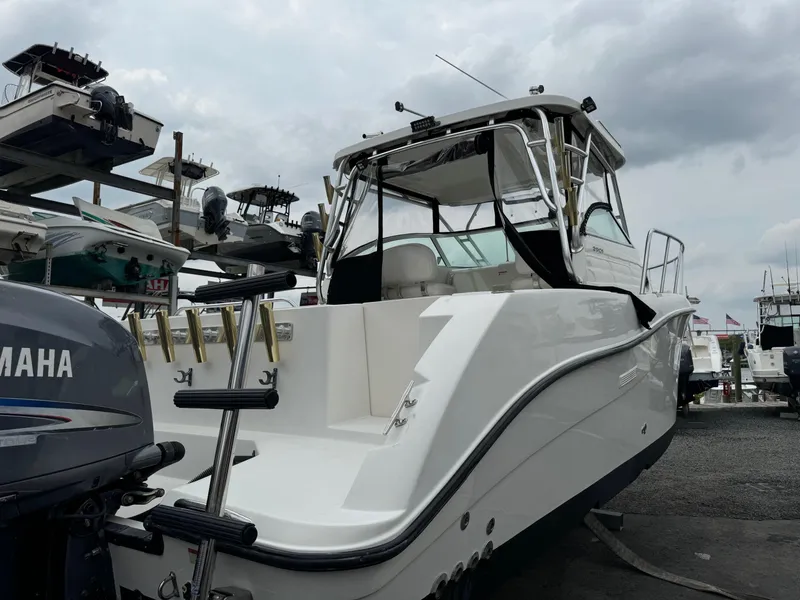 Slide: The Image of 2004 Seaswirl Striper 2901 Walkaround O/B boat at marina, overcast sky. - 2