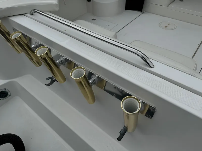 Slide: The Image of 2004 Seaswirl Striper 2901 Walkaround O/B boat rod holders and seating area. - 6