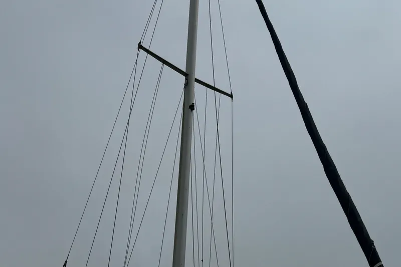 Slide: The Image of Mast and rigging of a 2005 Catalina 34 Mk II sailboat against a cloudy sky. - 26