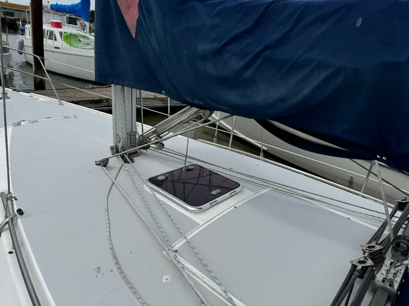 Slide: The Image of 2005 Catalina 34 Mk II sailboat deck with blue sail cover and rigging. - 8