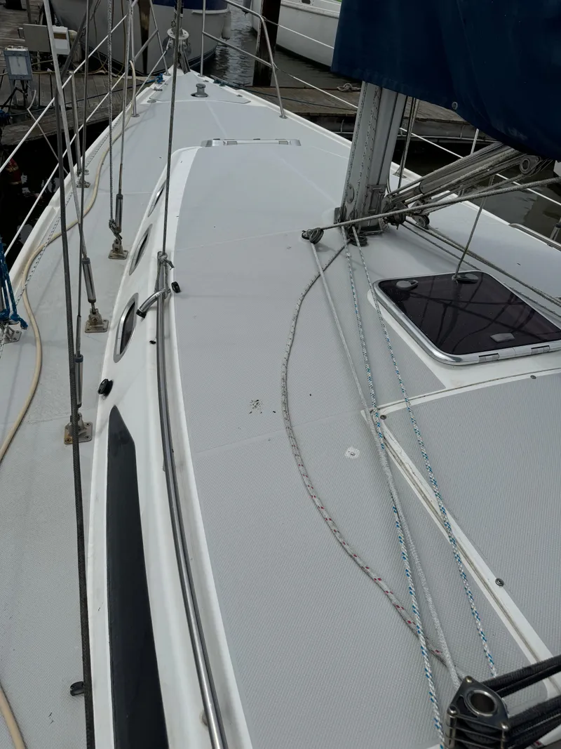 Slide: The Image of 2005 Catalina 34 Mk II sailboat deck with rigging and hatch. - 9