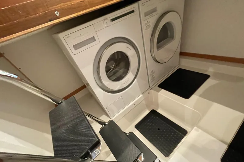 Slide: The Image of Laundry area in 2024 Sabre 43 Salon Express yacht with washer and dryer. - 38