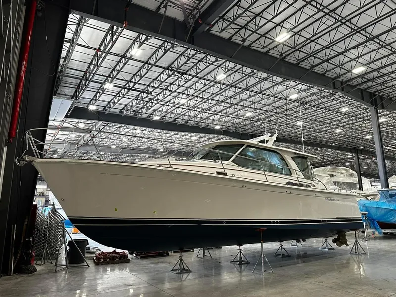 Slide: The Image of 2024 Sabre 43 Salon Express yacht in a spacious indoor marina setting. - 40