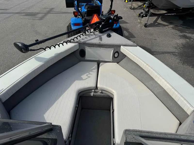 Slide: The Image of 2012 Starcraft Superfisherman 176 boat interior with seating and trolling motor. - 3