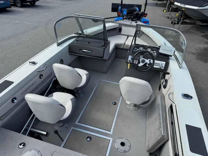 Slide: The Image of 2012 Starcraft Superfisherman 176 boat interior with seating and steering console. - 6