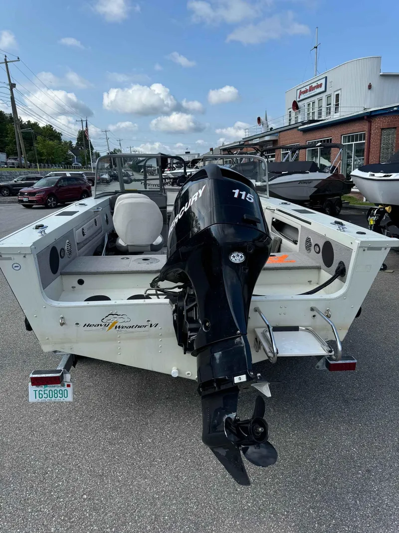 Slide: The Image of 2012 Starcraft Superfisherman 176 boat with Mercury 115 outboard motor, parked outdoors. - 7