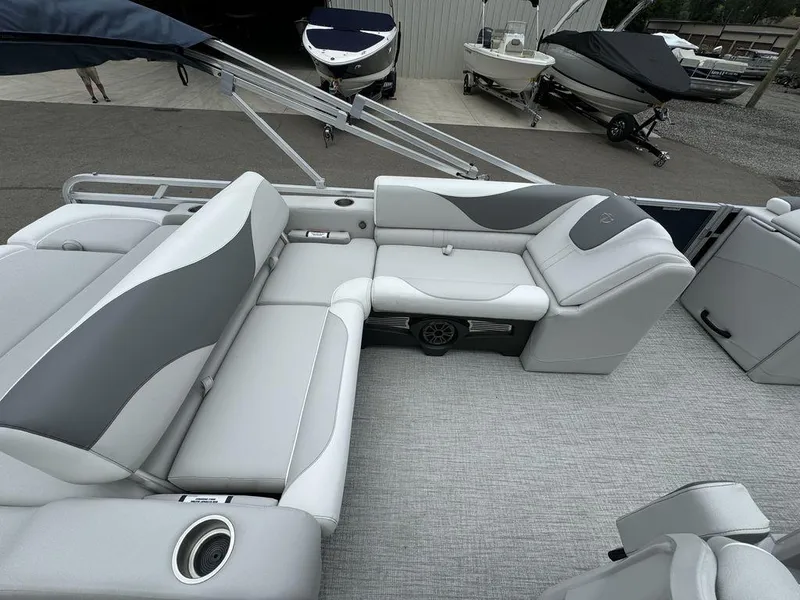 Slide: The Image of 2025 Tahoe LTZ 2385 VRB pontoon boat interior with gray seating and cup holders. - 6