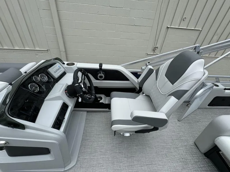 Slide: The Image of 2025 Tahoe LTZ 2385 VRB boat cockpit with modern steering and comfortable seating. - 8