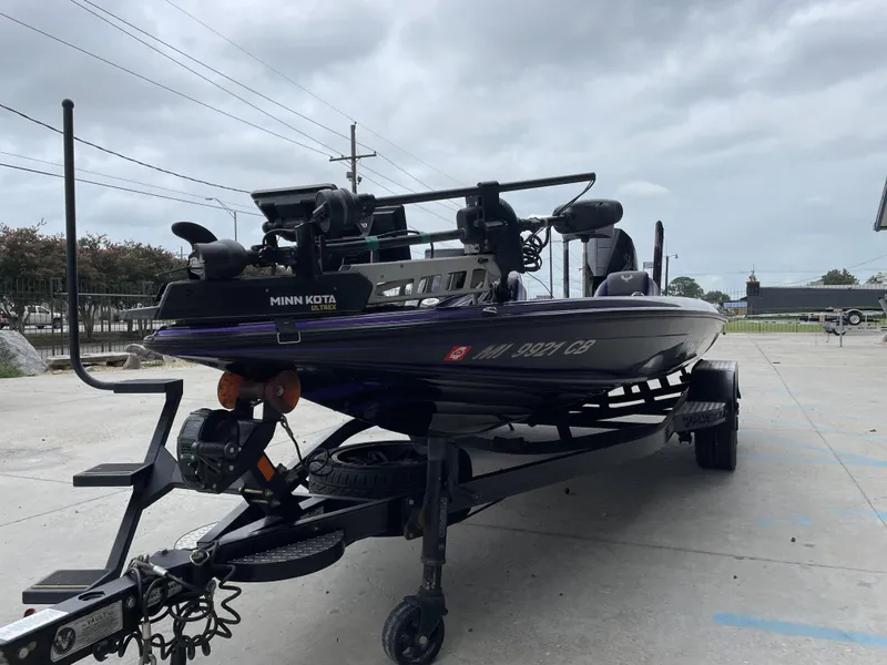 Slide: The Image of 2022 Phoenix 919 ProXP boat with Minn Kota Ultrex, parked on a trailer. - 10