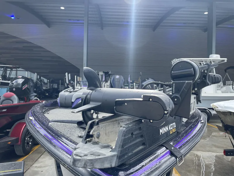 Slide: The Image of 2022 Phoenix 919 ProXP boat with Minn Kota Ultrex motor in a showroom. - 12