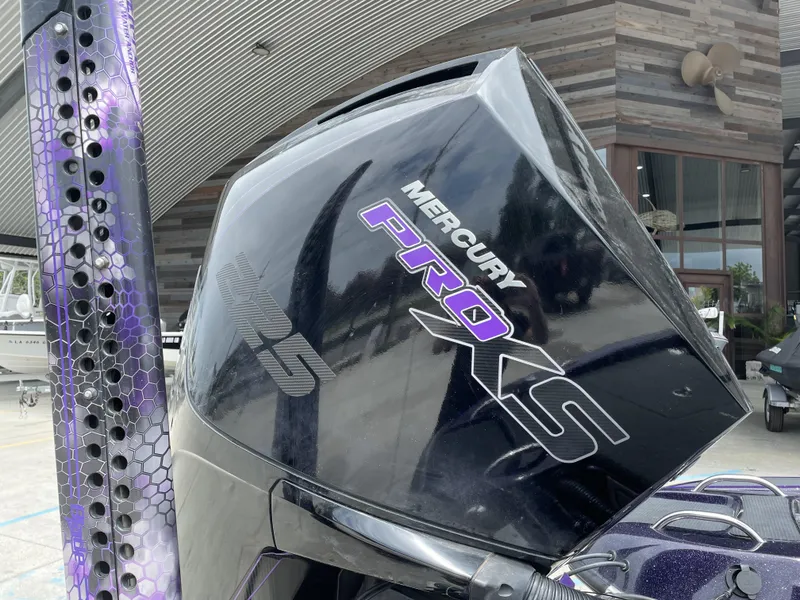 Slide: The Image of Close-up of a 2022 Phoenix 919 ProXP boat with Mercury Pro XS engine. - 14