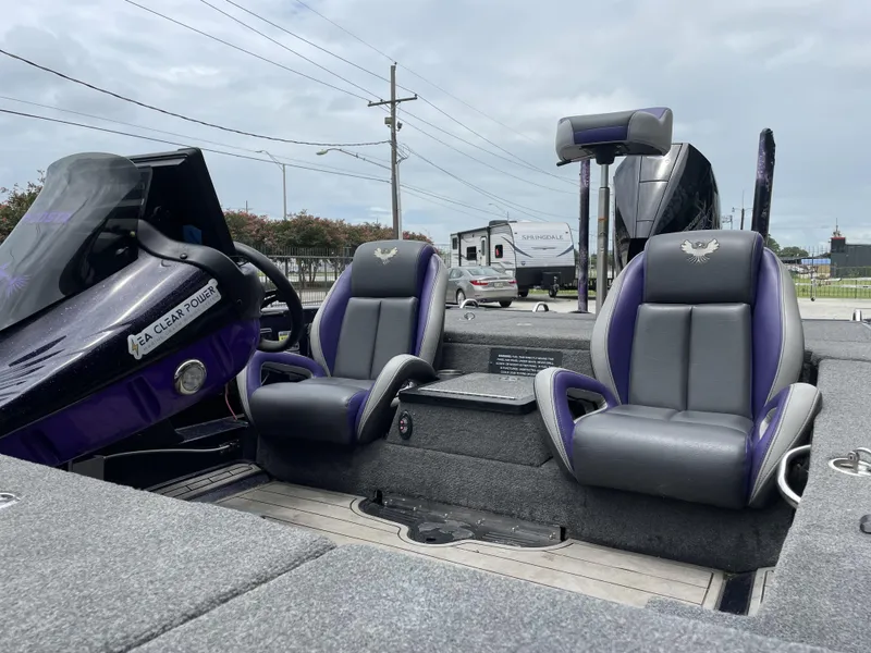 Slide: The Image of 2022 Phoenix 919 ProXP boat interior with dual seats and steering console. - 18