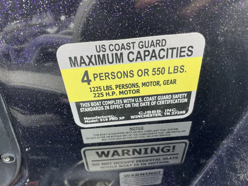 Slide: The Image of US Coast Guard capacity label on 2022 Phoenix 919 ProXP boat. - 21