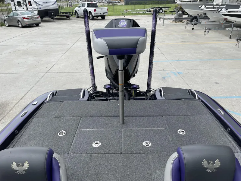 Slide: The Image of 2022 Phoenix 919 ProXP boat interior with seating and storage compartments. - 23