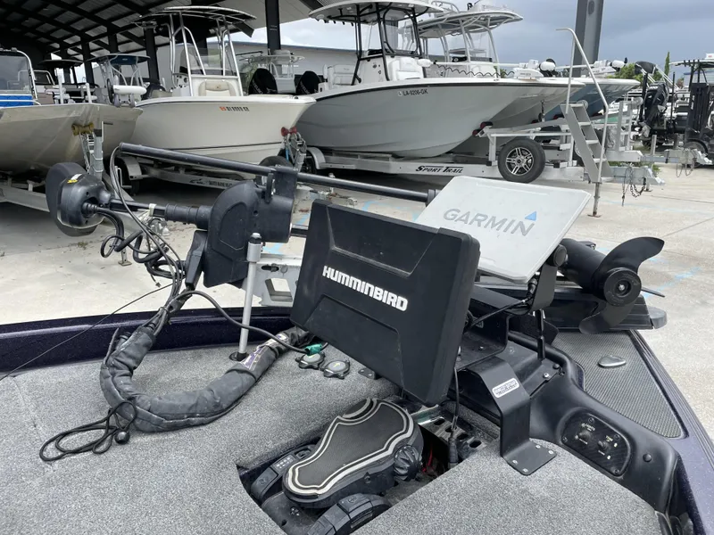 Slide: The Image of 2022 Phoenix 919 ProXP boat with Garmin and Humminbird electronics in a marina. - 5