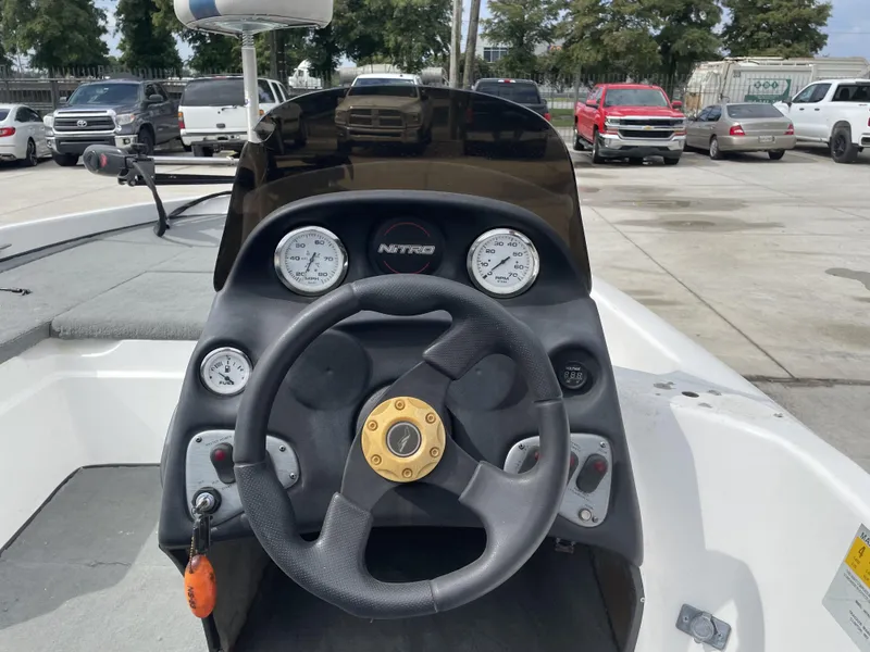 Slide: The Image of 2006 Nitro NX 750 boat dashboard with steering wheel and gauges. - 3