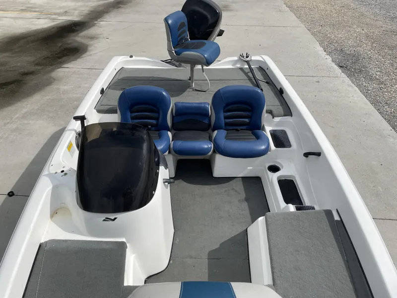 Slide: The Image of 2006 Nitro NX 750 boat with blue seats and spacious deck layout. - 6