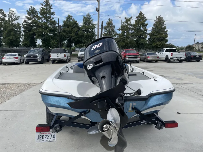 Slide: The Image of 2006 Nitro NX 750 boat with outboard motor in parking lot. - 8