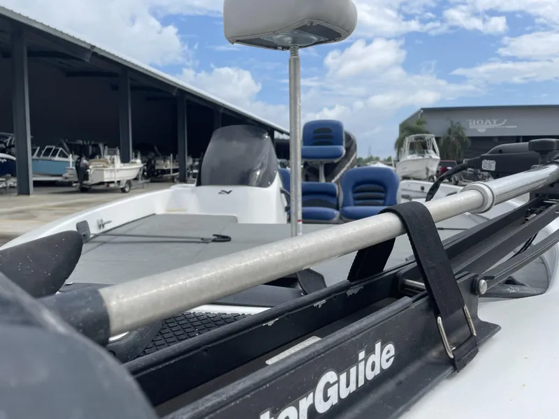 Slide: The Image of 2006 Nitro NX 750 boat with MotorGuide, docked under a cloudy sky. - 9
