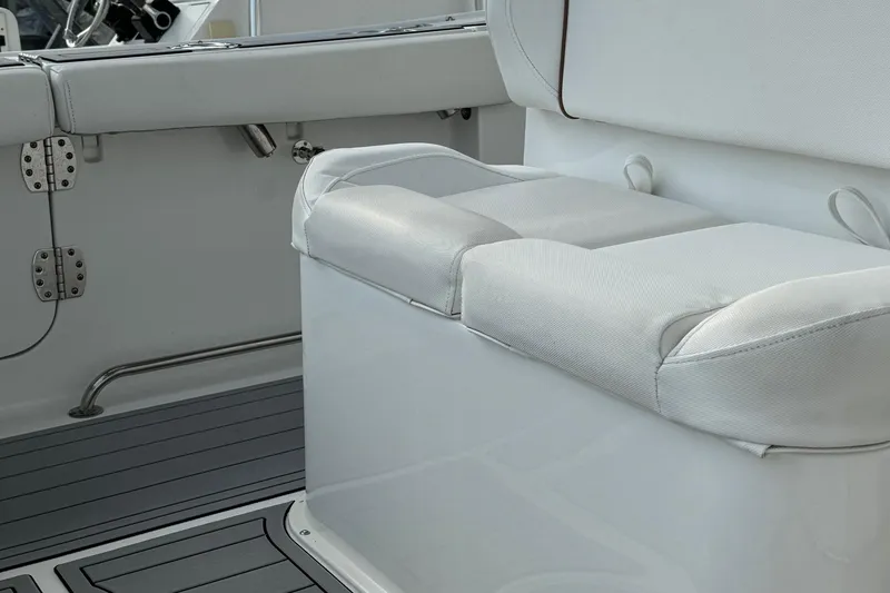 Slide: The Image of 2018 Sea Hunt Gamefish 27 boat interior with cushioned seating and sleek design. - 14