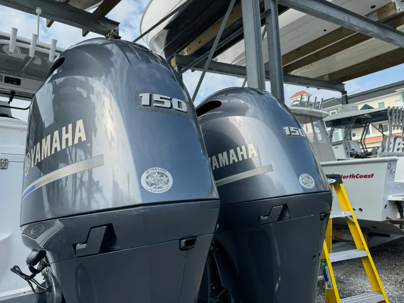 Slide: The Image of Twin Yamaha 150 outboard motors on a 2018 Sea Hunt Gamefish 27 boat. - 4