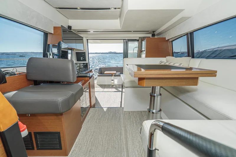 Slide: The Image of Luxurious interior of 2015 Prestige 420 yacht with modern seating and ocean view. - 16