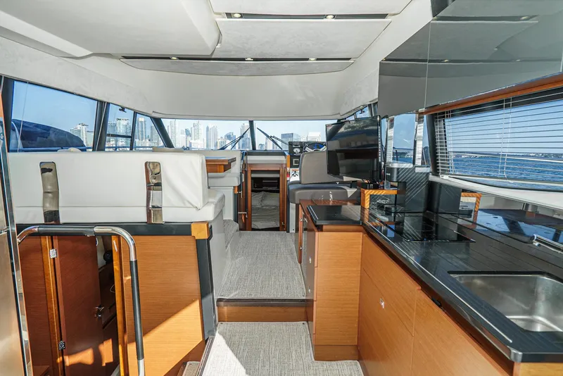 Slide: The Image of Luxurious interior of 2015 Prestige 420 yacht with modern kitchen and seating area. - 19