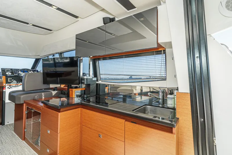 Slide: The Image of Modern kitchen interior of 2015 Prestige 420 yacht with sleek cabinetry and appliances. - 20