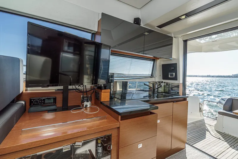 Slide: The Image of Luxurious interior of 2015 Prestige 420 yacht with modern kitchen and sea view. - 21