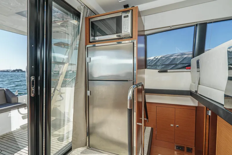Slide: The Image of Interior of 2015 Prestige 420 yacht with stainless steel fridge and microwave. - 22