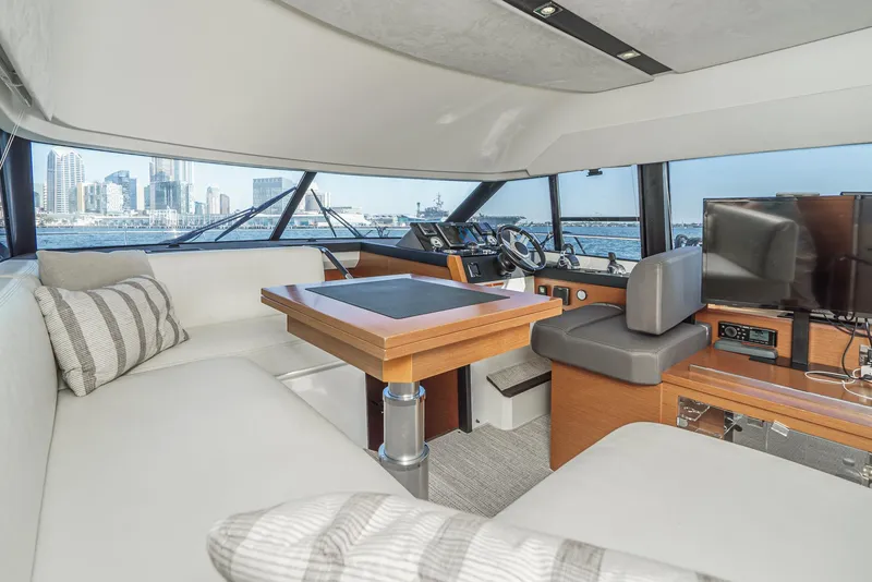 Slide: The Image of Luxurious interior of 2015 Prestige 420 yacht with city skyline view. - 25