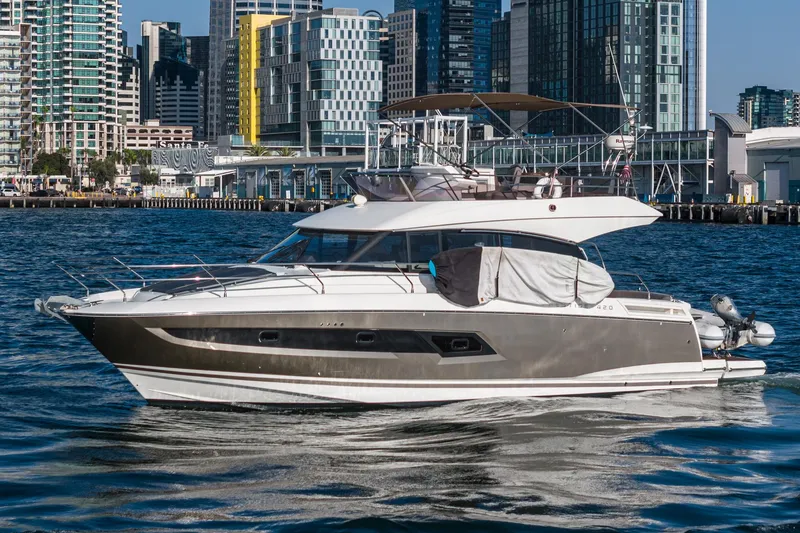 Slide: The Image of Prestige 420 yacht, 2015 model, cruising in urban waterfront setting. - 4