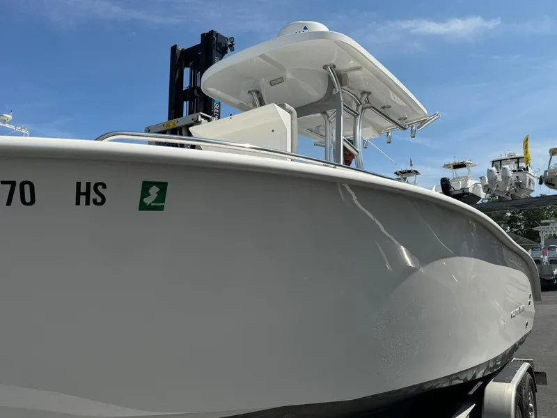 Slide: The Image of 2022 Cape Horn 22 OS boat, white hull, clear sky background. - 1