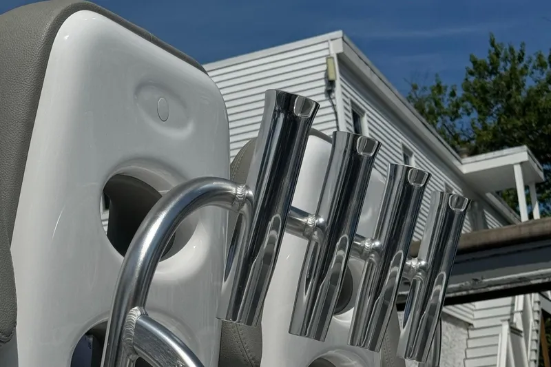 Slide: The Image of Cape Horn 22 OS 2022 boat rod holders against a house background. - 9