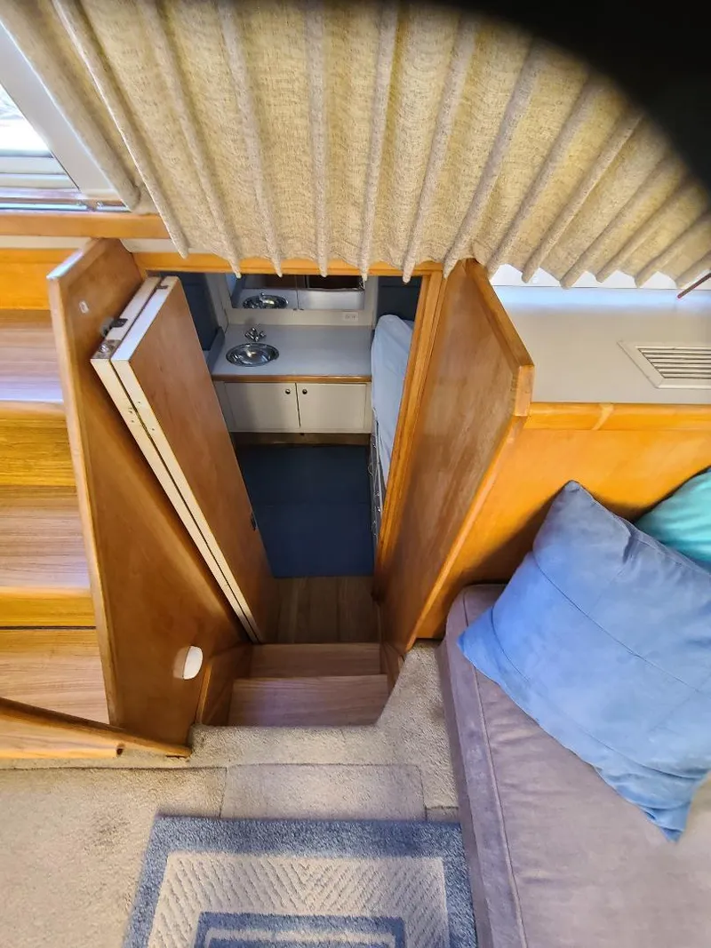 Slide: The Image of Interior view of 1995 Carver 325 Aft Cabin with stairs leading to cabin. - 35