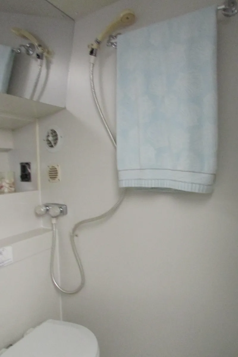 Slide: The Image of Bathroom interior of 1995 Carver 325 Aft Cabin yacht with shower and towel. - 24