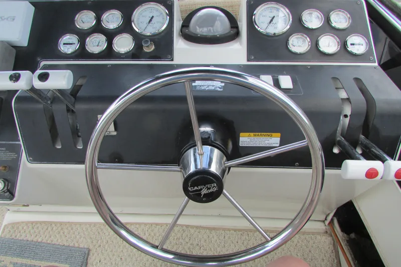 Slide: The Image of Steering wheel and dashboard of 1995 Carver 325 Aft Cabin boat. - 6