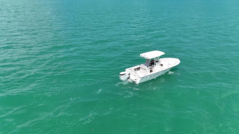 Slide: The Image of 2023 Sea Born LX24 boat cruising on turquoise ocean waters. - 3