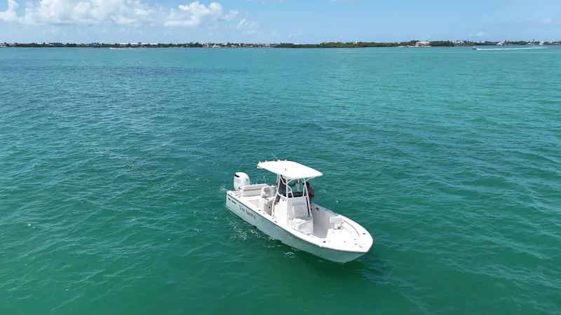 Slide: The Image of 2023 Sea Born LX24 boat on turquoise ocean water under clear sky. - 5