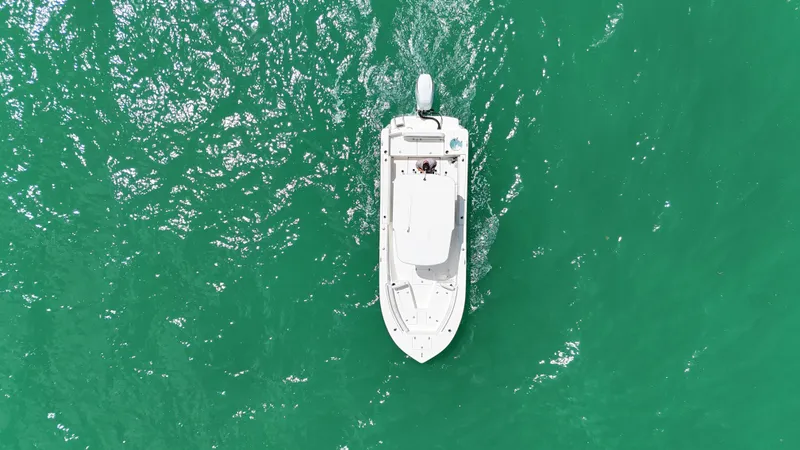 Slide: The Image of Aerial view of 2023 Sea Born LX24 boat on turquoise water. - 7