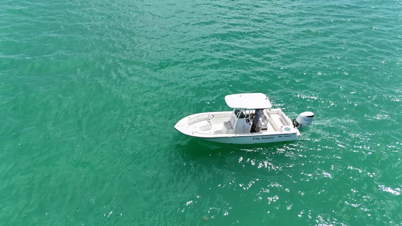 Slide: The Image of 2023 Sea Born LX24 boat on clear turquoise water. - 9