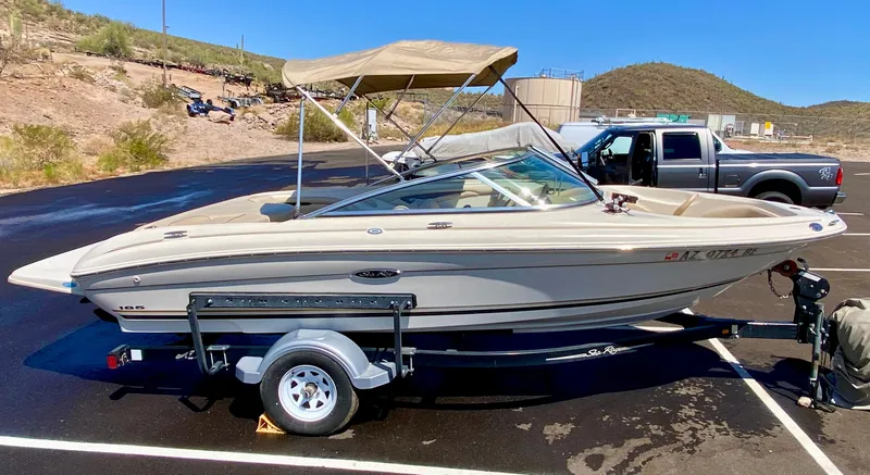 Slide: The Image of 2001 Sea Ray 185 Bow Rider on trailer parked outdoors. - 10