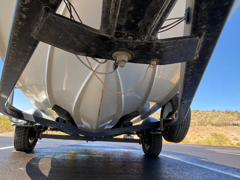 Slide: The Image of Underside of a 2001 Sea Ray 185 Bow Rider boat on trailer. - 11