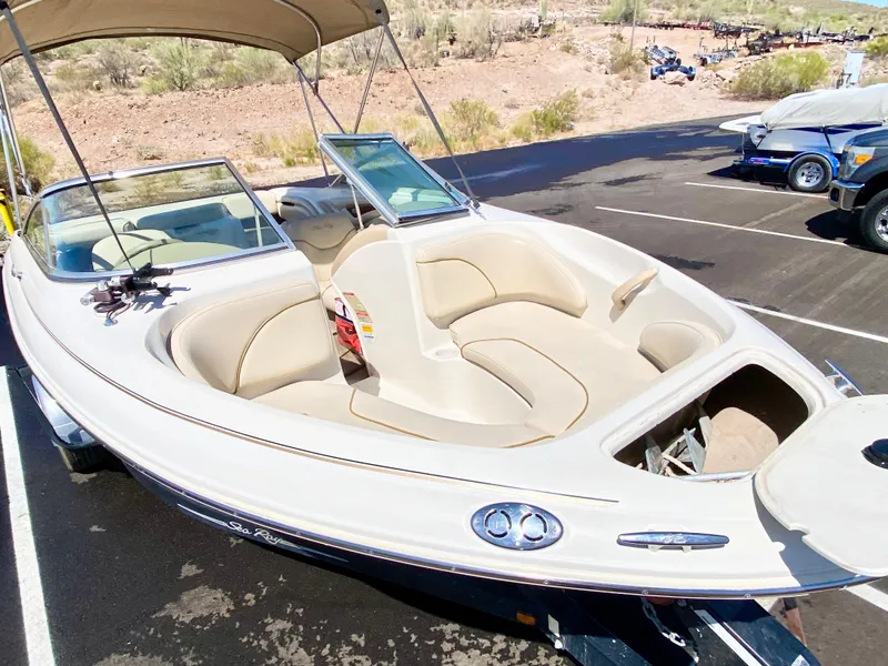 Slide: The Image of 2001 Sea Ray 185 Bow Rider boat in parking lot. - 12