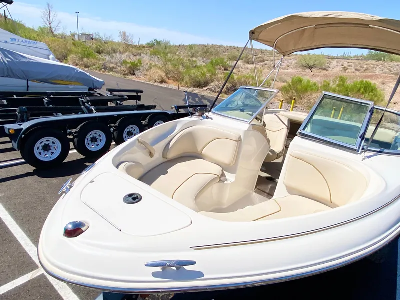 Slide: The Image of 2001 Sea Ray 185 Bow Rider with trailer, parked outdoors. - 13